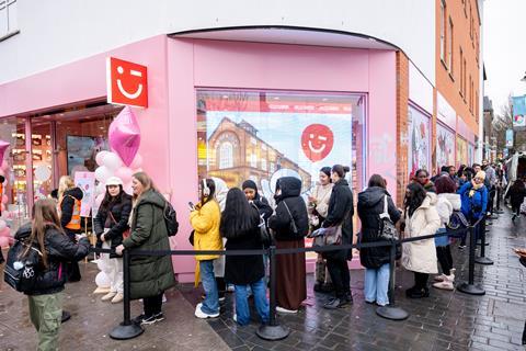 Customer queuing outside Miniso Camden store in London